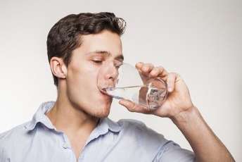 manual wash down the capsules whole with a glass of water